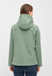 Zachte groene jas met een capuchon, gladde stof, eenvoudig ontwerp en een aansluitende snit. Beschikt over elastische manchetten en een naadloze achterkant.