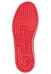 Suela de goma roja con una superficie texturizada que presenta un patrón de cuadrícula y un logo en el centro. Los bordes son negros con un acabado suave.