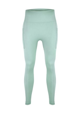 Miętowe legginsy o wysokim stanie, wykonane z elastycznego materiału, z bocznymi kieszeniami i gładkim, dopasowanym krojem bez widocznych zapięć.