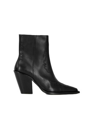 Black leather ankle boot with a pointed toe and textured detailing, featuring a chunky heel and decorative stitching along the sides.