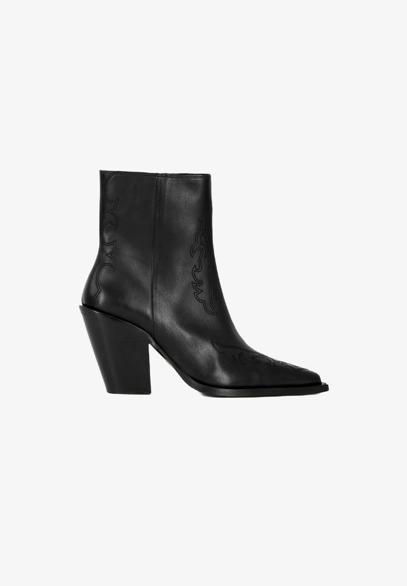 Black leather ankle boot with a pointed toe and textured detailing, featuring a chunky heel and decorative stitching along the sides.