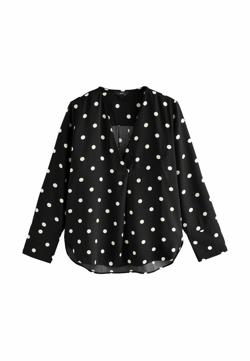 Schwarze Bluse mit weißen Polka-Dots, V-Ausschnitt, langen Ärmeln und abgerundetem Saum. Hergestellt aus einem leichten, glatten Stoff.