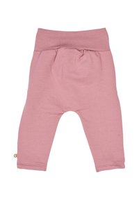 Světle růžové bavlněné kalhoty se širokým elastickým pasem, zúženými nohavicemi a malou štítkovou detalí na levé straně. Jemná a hladká textura.