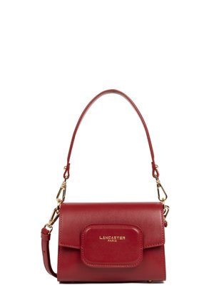 Red leather handbag with a structured design, gold hardware, a front flap pocket, and a detachable strap for versatile carrying options.