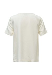T-shirt a maniche corte color crema, realizzato in tessuto morbido, con colletto rotondo e cinture arrotolate, dalla texture liscia e semplice.