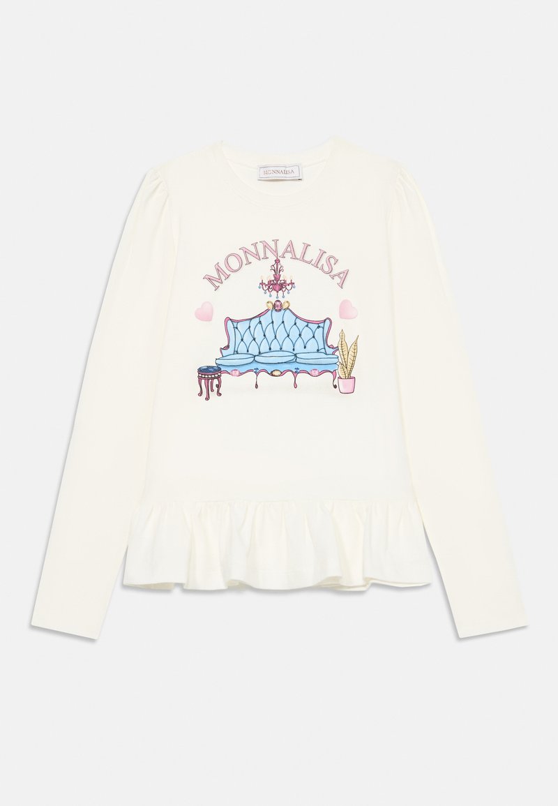 Camisa de mangas longas em creme com um gráfico de um sofá estofado azul, uma chandelier e uma planta em vaso, finalizada com uma bainha rendada.