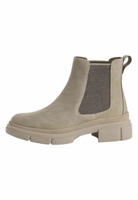 Botte de cheville en cuir beige avec des panneaux élastiques sur les côtés et une semelle épaisse. Finition texturée avec une languette à l'arrière.