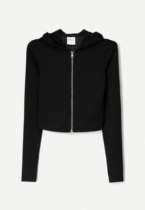 Svart kortärmad hoodie i mjukt material, med hel dragkedja fram, långa ärmar och dragsko i huvan. Enkel, minimalistisk design.