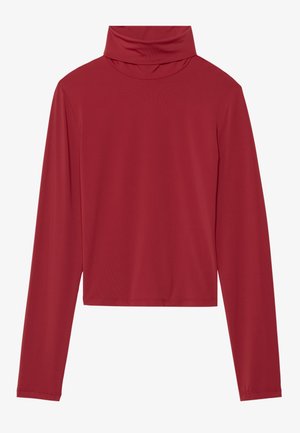 Punane pikade varrukatega mock neck topp, mis on valmistatud siledast kangast; kujundus on lühendatud ja laia lõikega ning servades on õmblused.