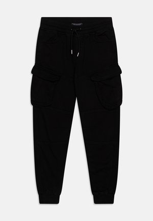 Pantalon cargo noir avec taille à cordon, deux poches à rabat sur les cuisses, poches latérales et poignets élastiques.