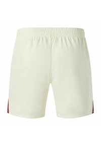 Pantaloncini sportivi color crema con vita elasticizzata, spacchi laterali e un dettaglio bordeaux sui lati inferiori. Realizzati in tessuto leggero.