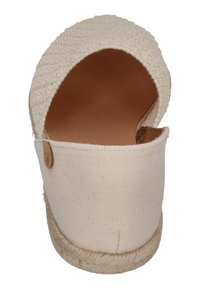 Beige canvas espadrille with an open back, woven upper, and a rope sole. Features a small logo tag on the side. Smooth inner lining.