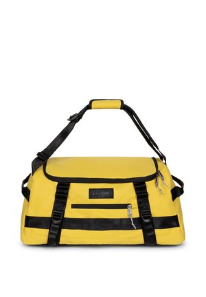 Bolsa de lona amarilla con correas negras y acolchado en la asa, bolsillo delantero con cremallera y correa de hombro ajustable, marca Eastpak.