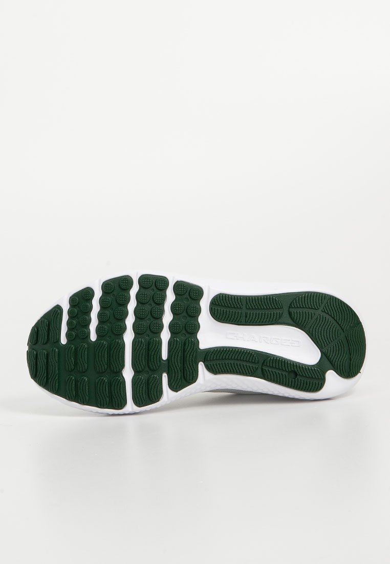 Suela de zapato con una base blanca y goma verde texturizada, que presenta patrones y surcos distintivos para agarre y estabilidad.