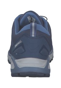 Blue athletic shoe with a textured fabric upper, reinforced heel, and contrasting light gray sole. Features a vertical stripe on the back.