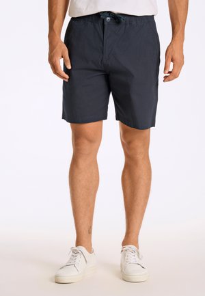 Marineblauwe shorts met een elastische tailleband en een trekkoord, voorzien van zijzakken en een rechte snit, gemaakt van lichtgewicht stof.