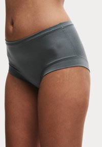 Šedé bezešvé bavlněné boxerky s hladkou texturou, středním pasem a širokým páskem. Vyznačují se minimalistickým designem bez vzorů.