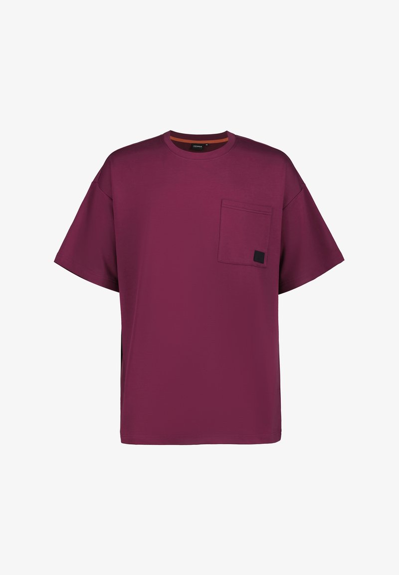 Camiseta oversized color burdeos hecha de una tela suave, con un solo bolsillo en el pecho y un detalle de contraste en el interior del cuello.