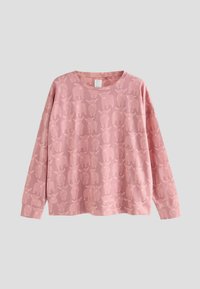 Roze longsleeve sweatshirt met een volledig lichtroze patroon van hooglandkoeien en een ronde halslijn op een effen achtergrond.