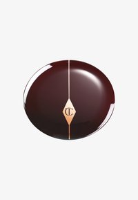 Round, deep burgundy container with a glossy finish, featuring a gold diamond accent and logo centered vertically.