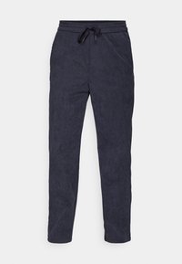 Navyblaue, leichte Sweatpants aus strukturiertem Stoff, ausgestattet mit einem elastischen Bund und Kordelzug sowie einem schmal zulaufenden Bein Design.