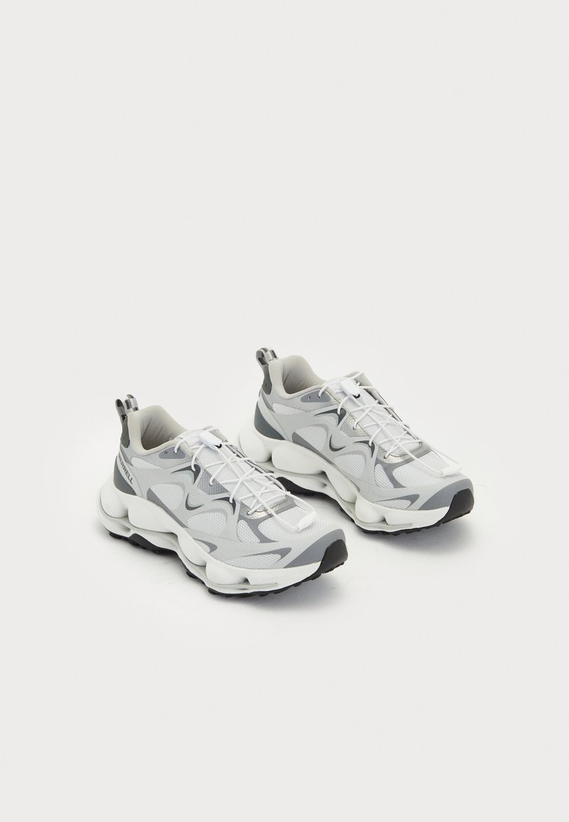 Lightweight athletic shoes in grey and white mesh with textured overlays, featuring a thick, cushioned sole and elastic laces.