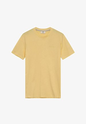 Geltonas medvilninis marškinėliai su apvalia apykakle, trumpomis rankovėmis ir subtiliu prekės ženklo LOGO ant krūtinės. Minkšta tekstūra ir lygus dizainas.
