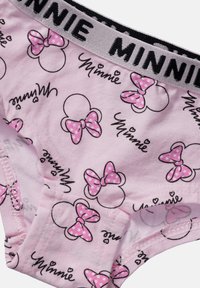 Mutandine per bambini rosa con sagome ripetute della testa di Minnie Mouse e fiocchi rosa a pois, caratterizzate da un elastico grigio con la scritta "MINNIE" in lettere nere.