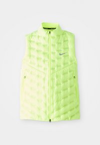 Gilet Nike giallo neon, design a puffer testurizzato, senza maniche, chiusura frontale a zip, logo riflettente, due tasche laterali con zip.