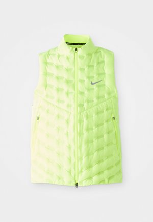 Neongele Nike-vest, met een geprofileerd pufferontwerp, mouwloos, met rits aan de voorkant, reflecterend logo, twee ritszakken aan de zijkant.