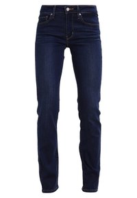 Mörkblå denimjeans med slim fit, medelhög midja, diskret fickstitching och klassisk femficksdesign.