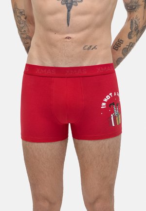 Boxer shorts de algodón rojos con un ajuste ceñido, cinturilla con la inscripción "XMAS" y un estampado gráfico de regalos con el texto "NO SOY UN Santa".