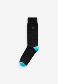 Black sock with a textured cuff, featuring a blue logo and blue accent at the toe. Material appears smooth and stretchy.
