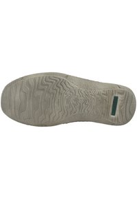 Shoe sole made of rubber, featuring a textured wave pattern, primarily in light gray, with a small green accent label on the side.