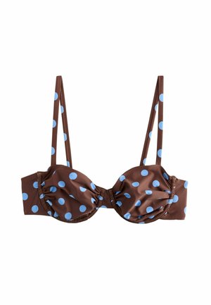 Brown bra with light blue polka dots, thin adjustable straps, and underwire cups for support.