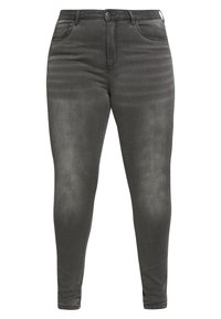 Dark grey skinny jeans made of denim with a smooth texture. Features include a high waist, front pockets, and a faded finish.