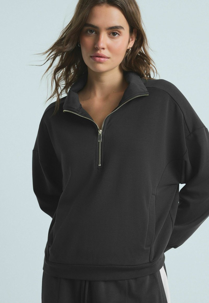 Next HALF ZIP - Pusa - black