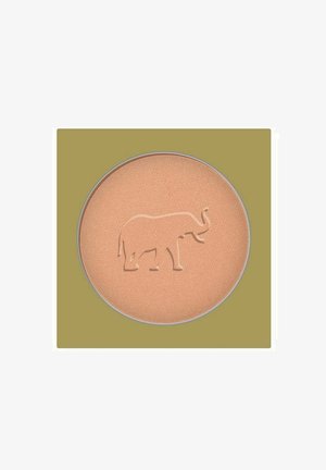 Paina beigevärinen puuterikompakti, jossa kohokuvioitu norsun ääriviiva keskellä, oliivinvihreän neliötaustan edessä.