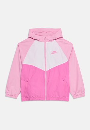 Veste à capuche Nike enfant avec fermeture éclair devant, bloc de couleurs rose et blanc, poignets élastiques et poches latérales zippées.