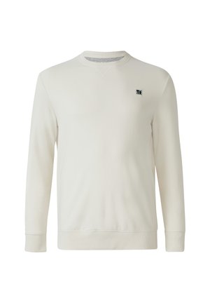 Crème kleurige sweatshirt met lange mouwen, ronde hals, ribgebreide manchetten en zoom, en een klein zwart logo op de linker borst.