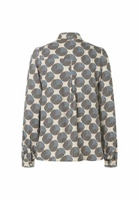 Langarmhemd in Creme mit einem schwarz-blauen kreisförmigen Muster, mit einem geknöpften Kragen und gerafften Ärmeln. Glatte Stoffstruktur.