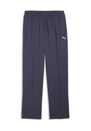 Pantalon de sport bleu foncé, coupe ample, avec taille élastique et petit logo Puma blanc sur la cuisse droite.