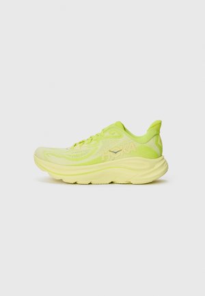 Scarpa sportiva verde lime con tomaia leggera in mesh, intersuola morbida e logo HOKA. Punta arrotondata e collare imbottito per il comfort.