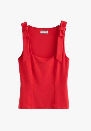 Rød ærmeløs top med firkantet udskæring, struktureret stof og to sløjfedetaljer på skuldrene. Mærket siger "Holly & Whyte."