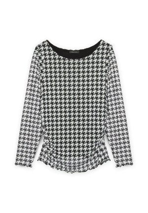 Haut à manches longues noir et blanc à motif pied-de-poule avec un col rond et un ourlet légèrement volant�é ainsi que des poignets froncés.