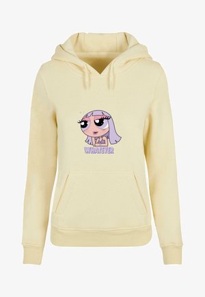 Keltainen huppari etutaskulla, jossa on sarjakuvahahmon grafiikka ja teksti "MITÄ VAAN" alla. Pehmeää kangasta ja ribbatut hihansuiden päät.