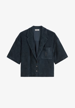 Dunkelblazer in Marineblau mit kurzen Ärmeln aus weichem, strukturiertem Stoff. Verfügt über einen Reverskragen, eine Fronttasche und fünf schwarze Knöpfe.