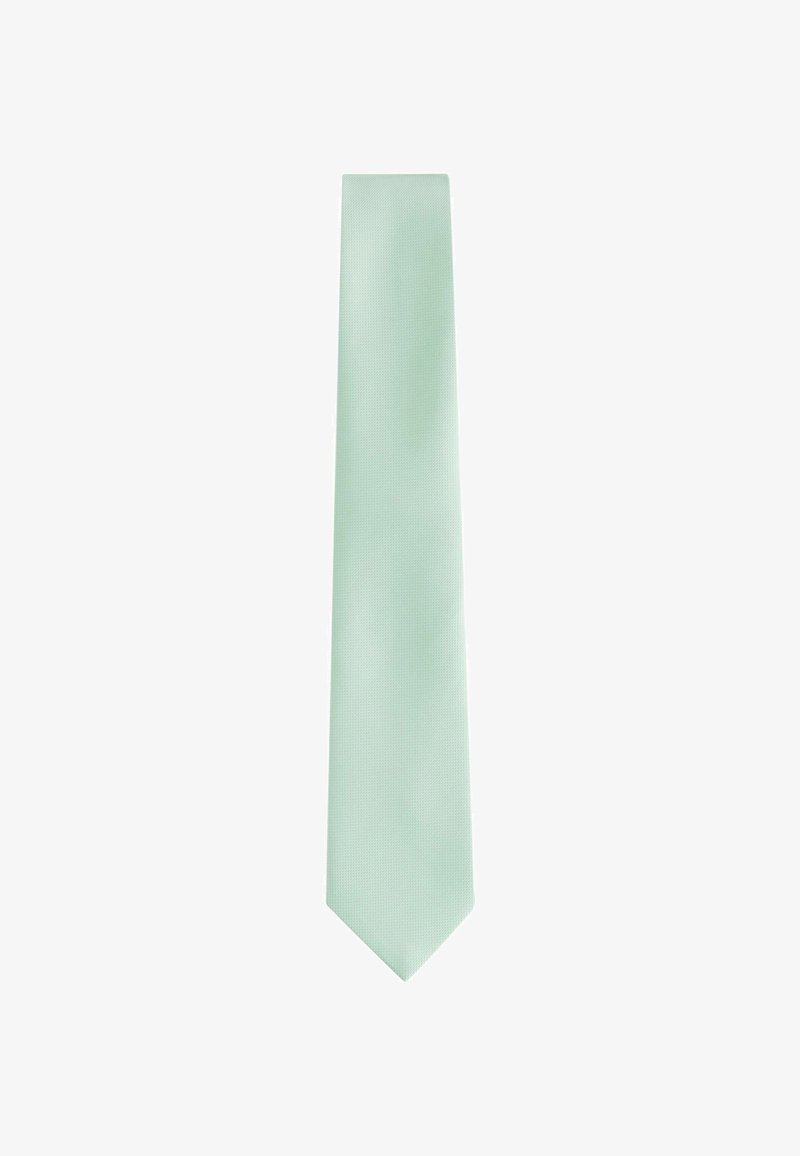 Cravate vert clair avec une surface texturée, au design slim et à l'extrémité pointue, présentant un motif subtil sur l'ensemble.