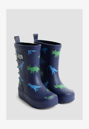 Marineblaue Gummiregenstiefel besitzen Dinosaurierdesigns in Grün und Blau, mit strukturierten Stacheln auf der Rückseite und Zuglaschen für ein einfaches Anziehen.