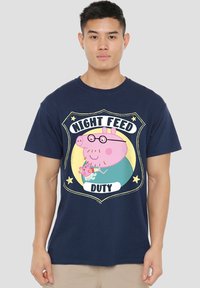 Navy blue t-shirt featuring a cartoon design of a pig wearing glasses with the text "NIGHT FEED DUTY" and a small pig character.